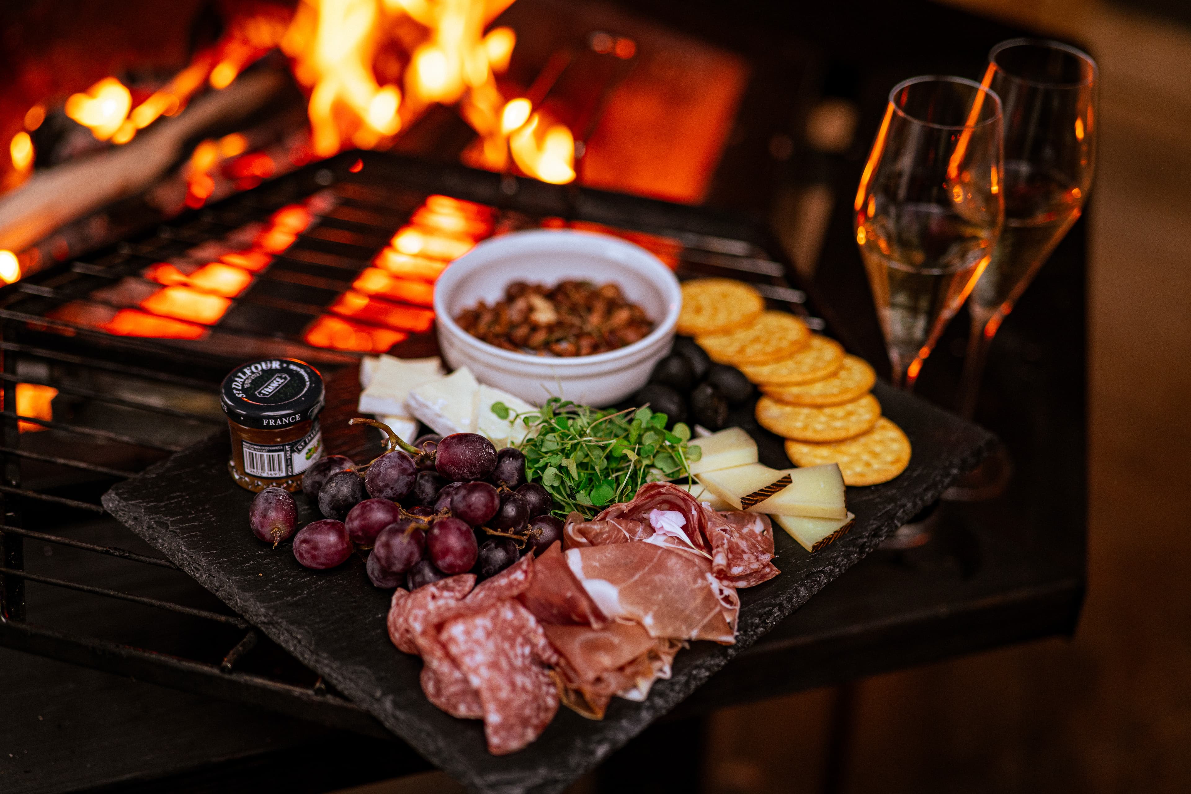 Charcuterie board by the fireplace