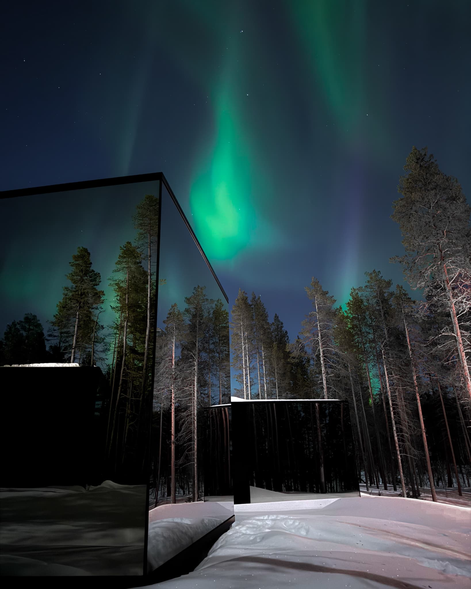 Mirror igloos under aurora
