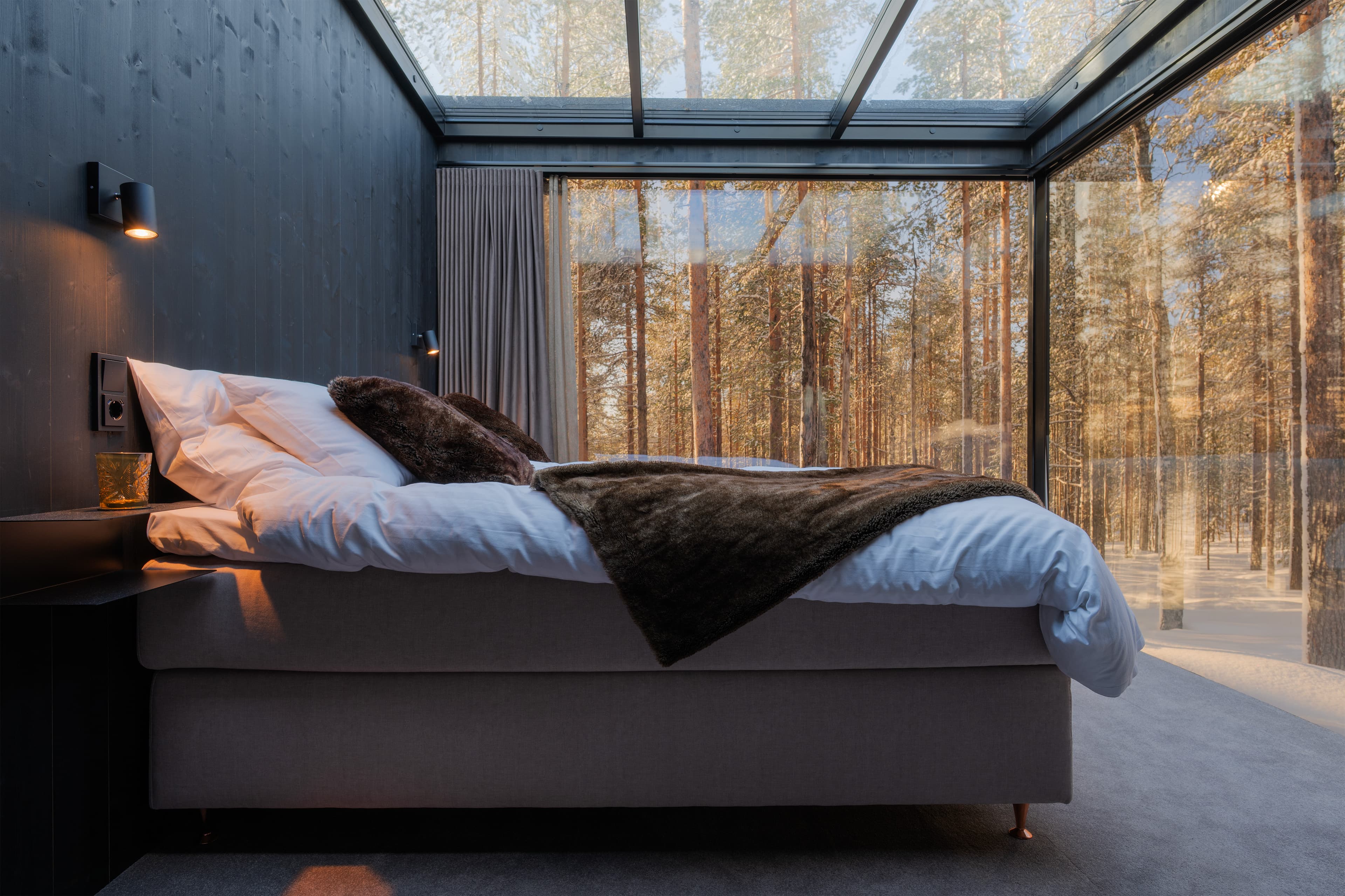 A glass igloo in autumn ruska colours
